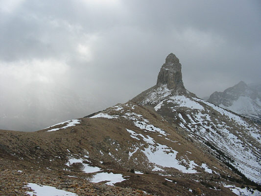 Another smaller pinnacle, Papoose, is hidden behind Squaw Mountain in this photo.