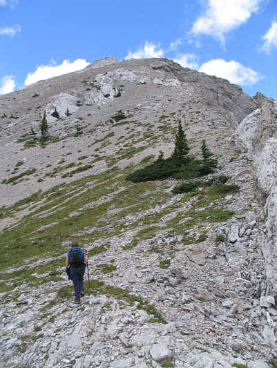 Because of foreshortening, the summit is a bit further away than it appears.  Only a bit though.