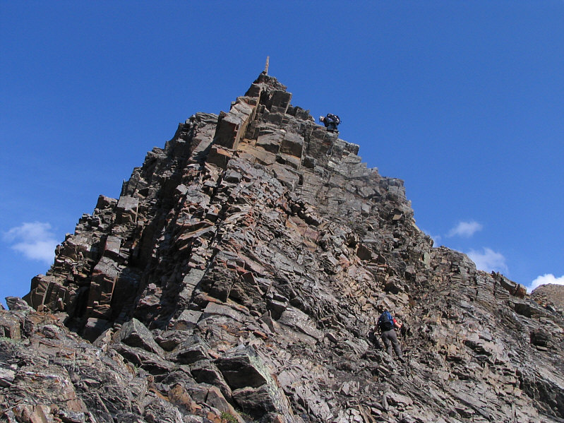 Most likely someone stuck the needle-like rock there.