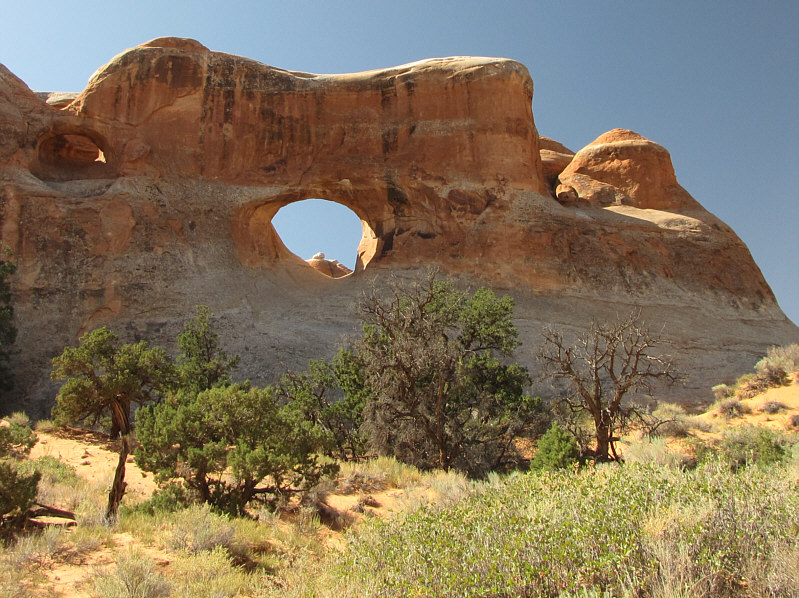I think Tunnel Arch actually refers to the obscure arch at far left which 'tunnels' through to the other side of the wall.