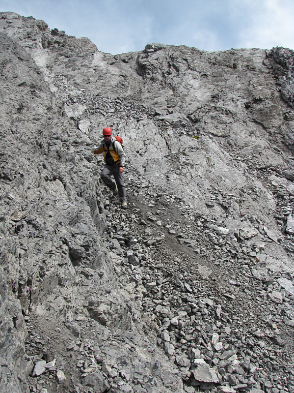 After descending to the first obvious weakness, you should climb all the way back up to regain the ridge.