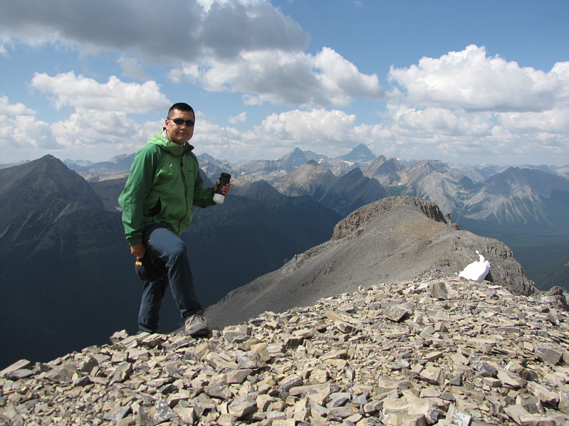 A Mexican tourist and a one-armed man came up to the summit while I was signing the register.