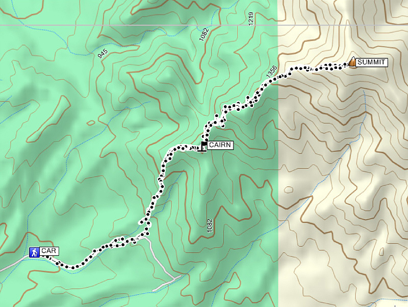 The cairn marks a bypass route around one of the false summits along the ridge.