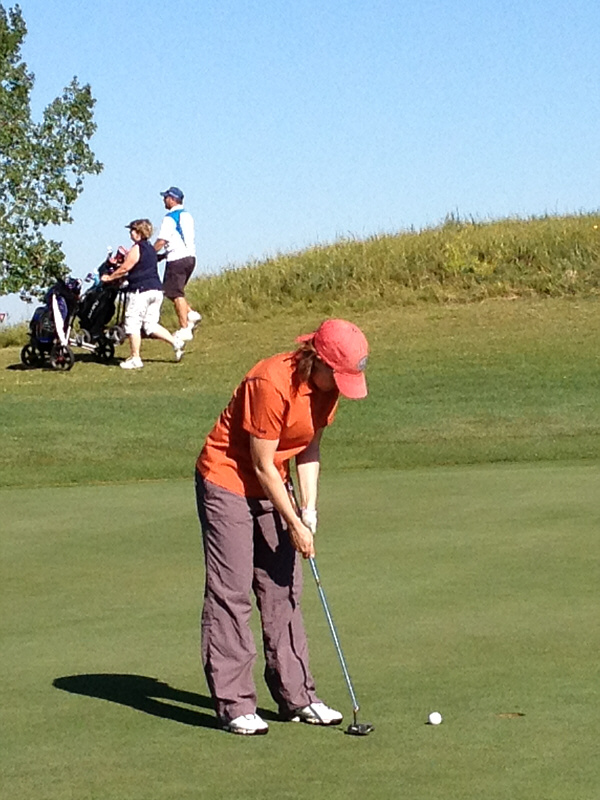 Those folks in the background must be looking for stray balls.