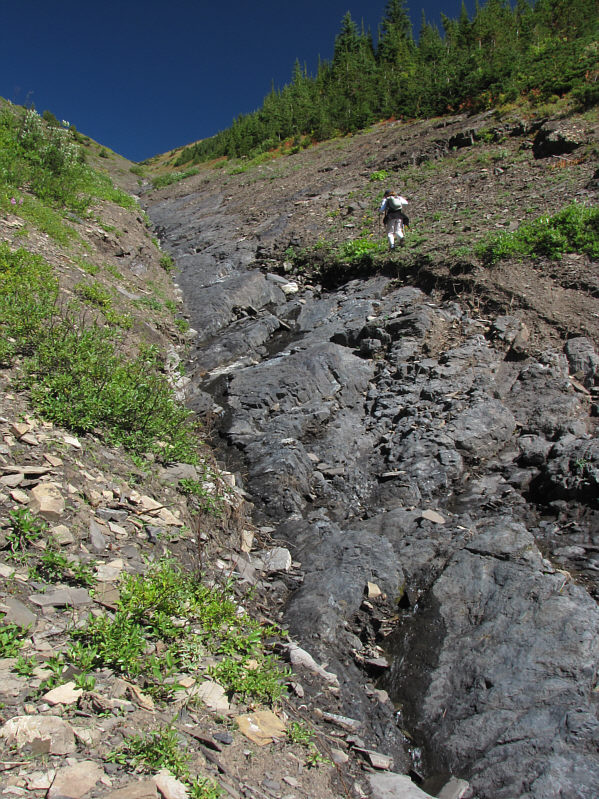 Despite water flowing down, it's best to stick to the middle as much as possible.
