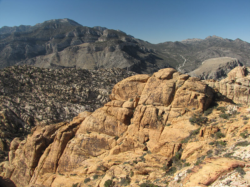 The lower summit is a much easier scramble.