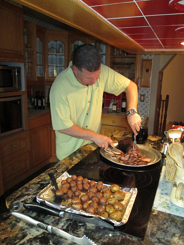 After forgetting to bring his own knives, Warner is practically using a butter knife to hack through the meat!