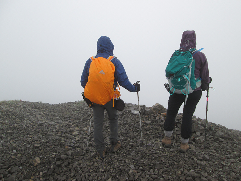 While Bob looks colour-coordinated, Dinah's green pack absolutely clashes with her purple jacket!