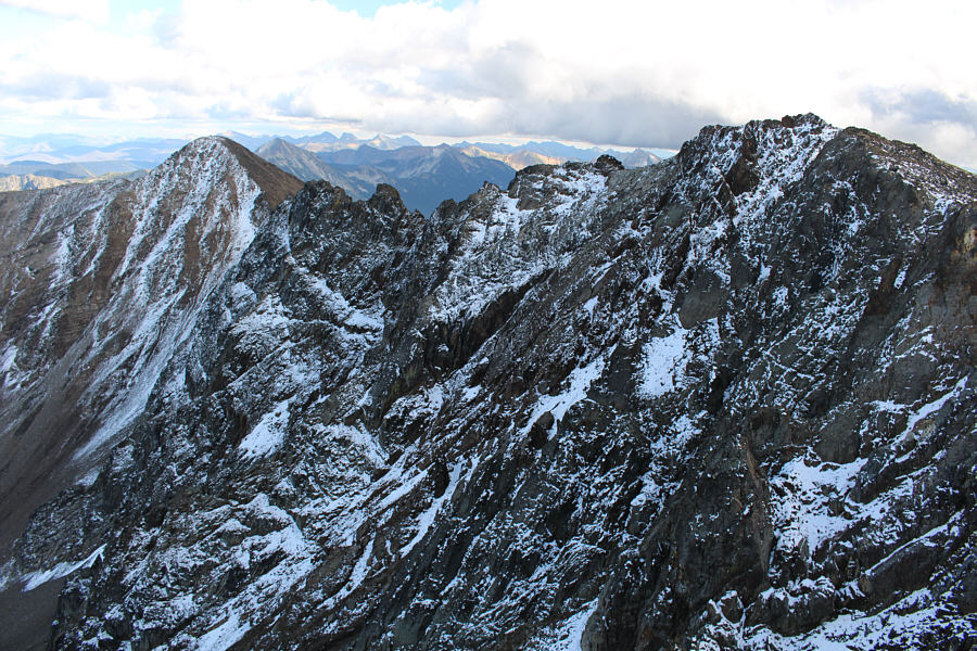 Looks unappealing to go all the way back to the East Summit, but that would be my recommended route of descent!