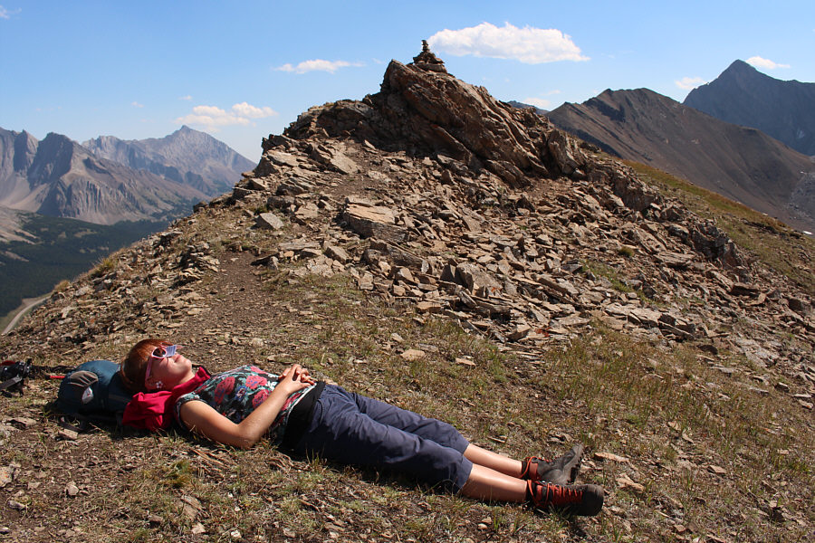 She's using a folded business card as a nose shield-- how clever!