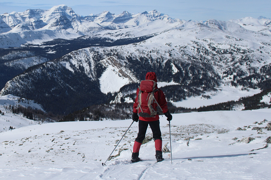 She is actually skiing down with her skins on at this point!