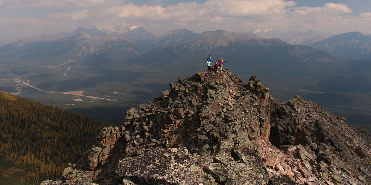 Strangely enough, there is a cairn on the false summit but not the true high point.