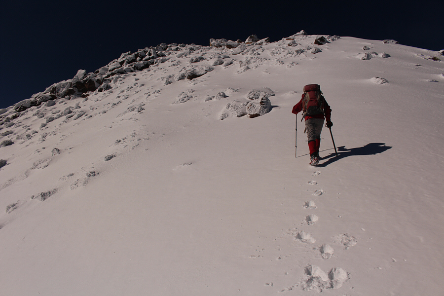 This slope was hard packed and steep enough for Zosia to break out her ice axe.