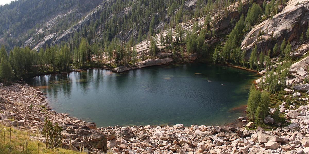 There are nice camping spots in the trees to the left.