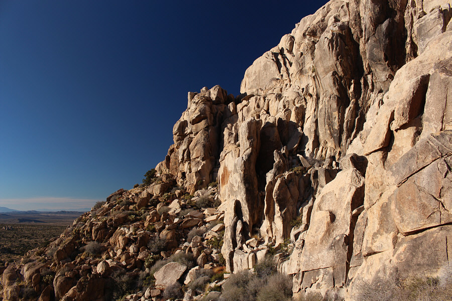 It's best to stick as close as possible to the base of the cliffs.