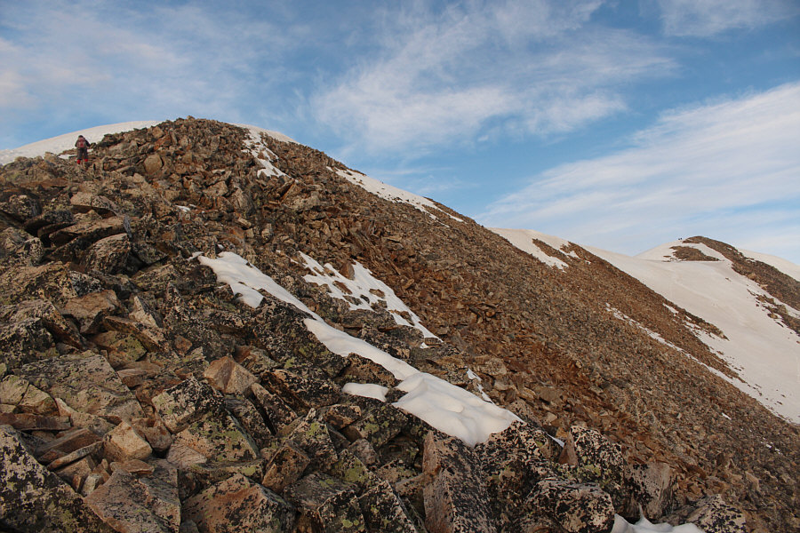 There are a few different beaten paths going up the boulders here.