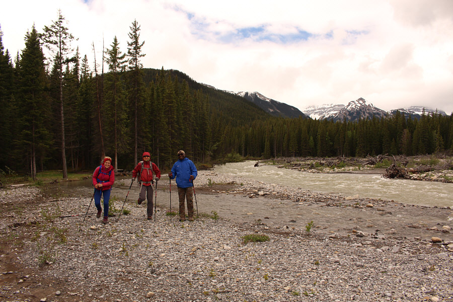 There is a commercial horse outfitter's designated lunch spot with an outhouse in the trees behind Dorota.