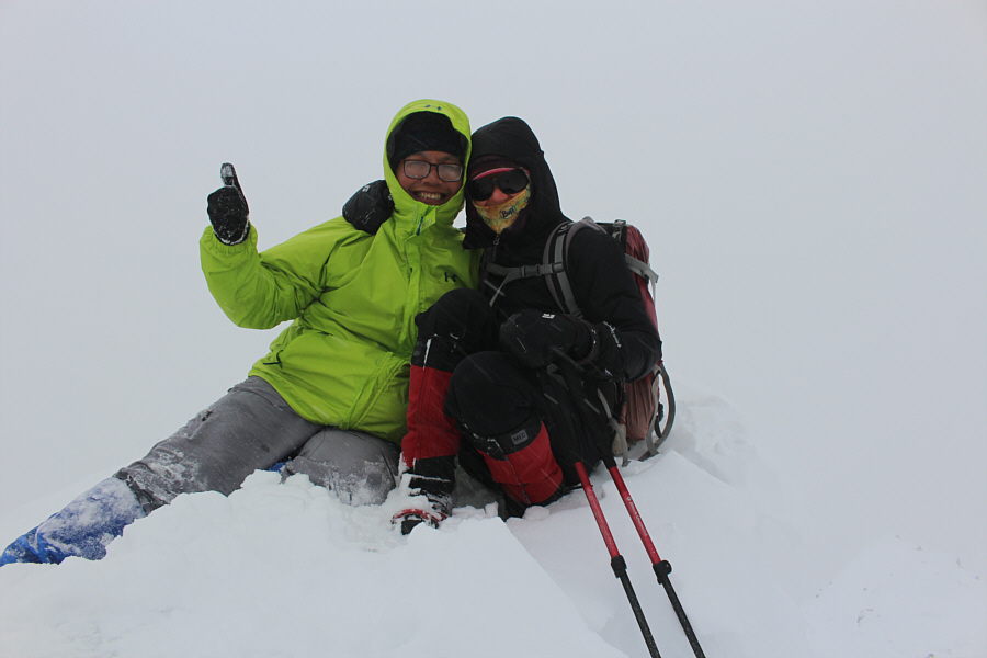 Looks like we're just sitting in a pile of snow and not some summit!