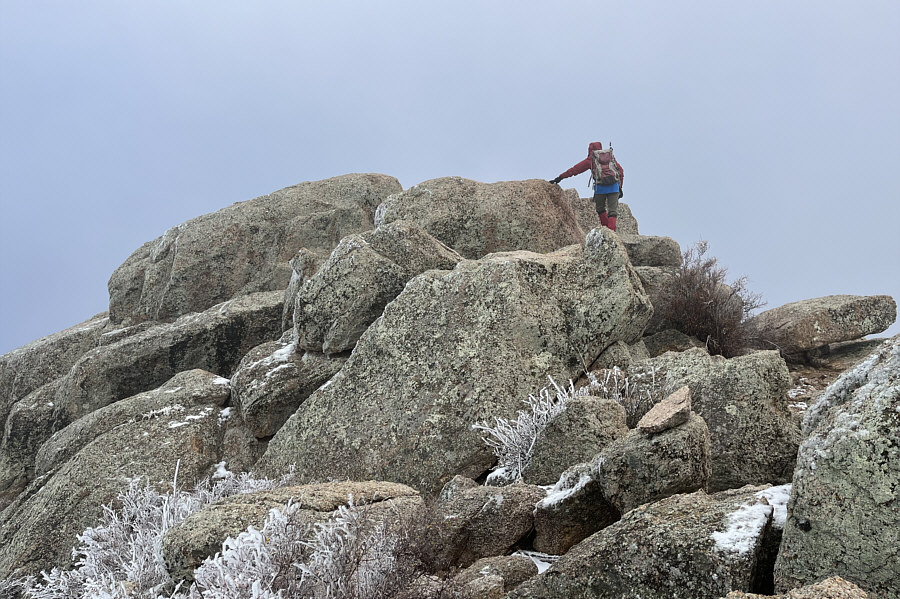The highest boulder looks innocuous enough from here...