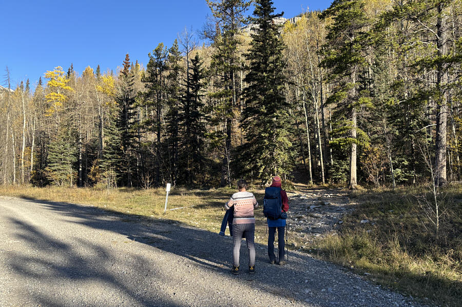 Teresa is taking off her jacket since she has been properly warmed up and is ready for the real hiking to begin!