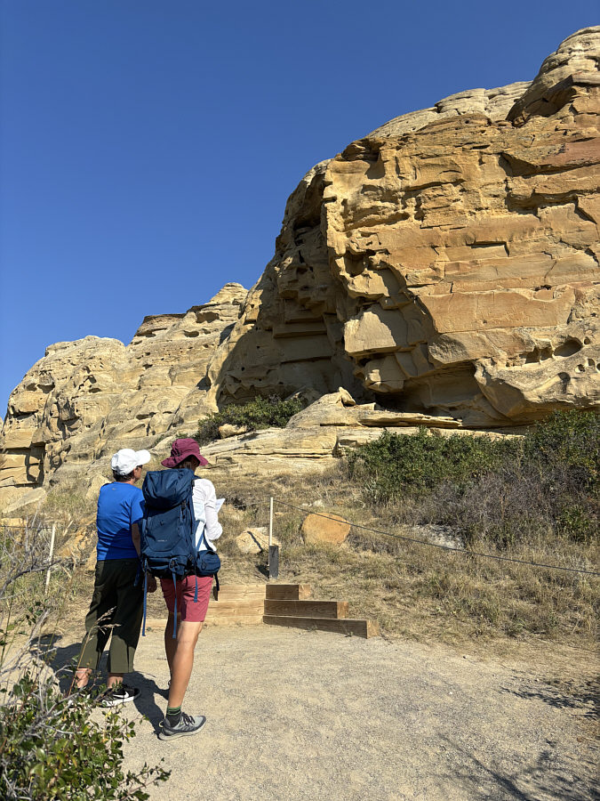 A petroglyph is a rock carving. A pictograph is a painting on rock.